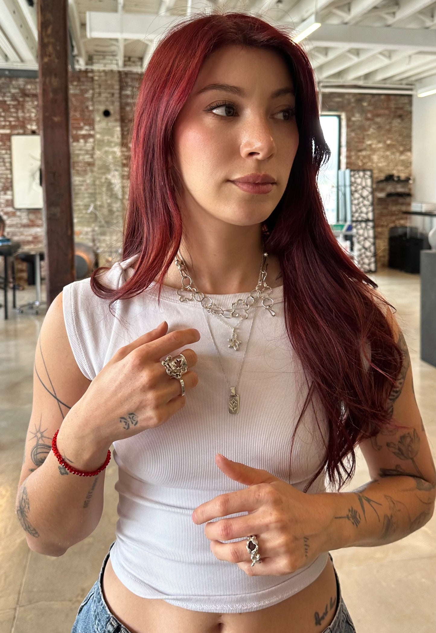 girl wearing amemori 935 silver rings at tattoo parlor
