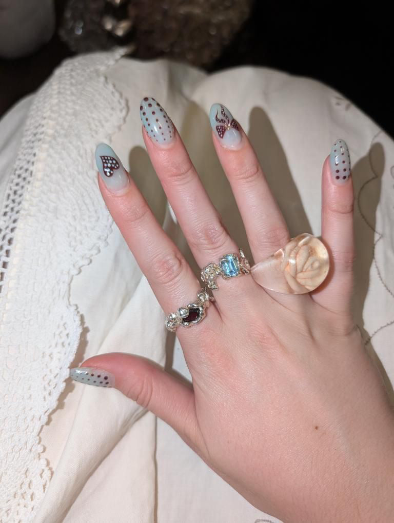 stunning 935 silver ring with blue topaz worn on hand, Mexico City jewelry