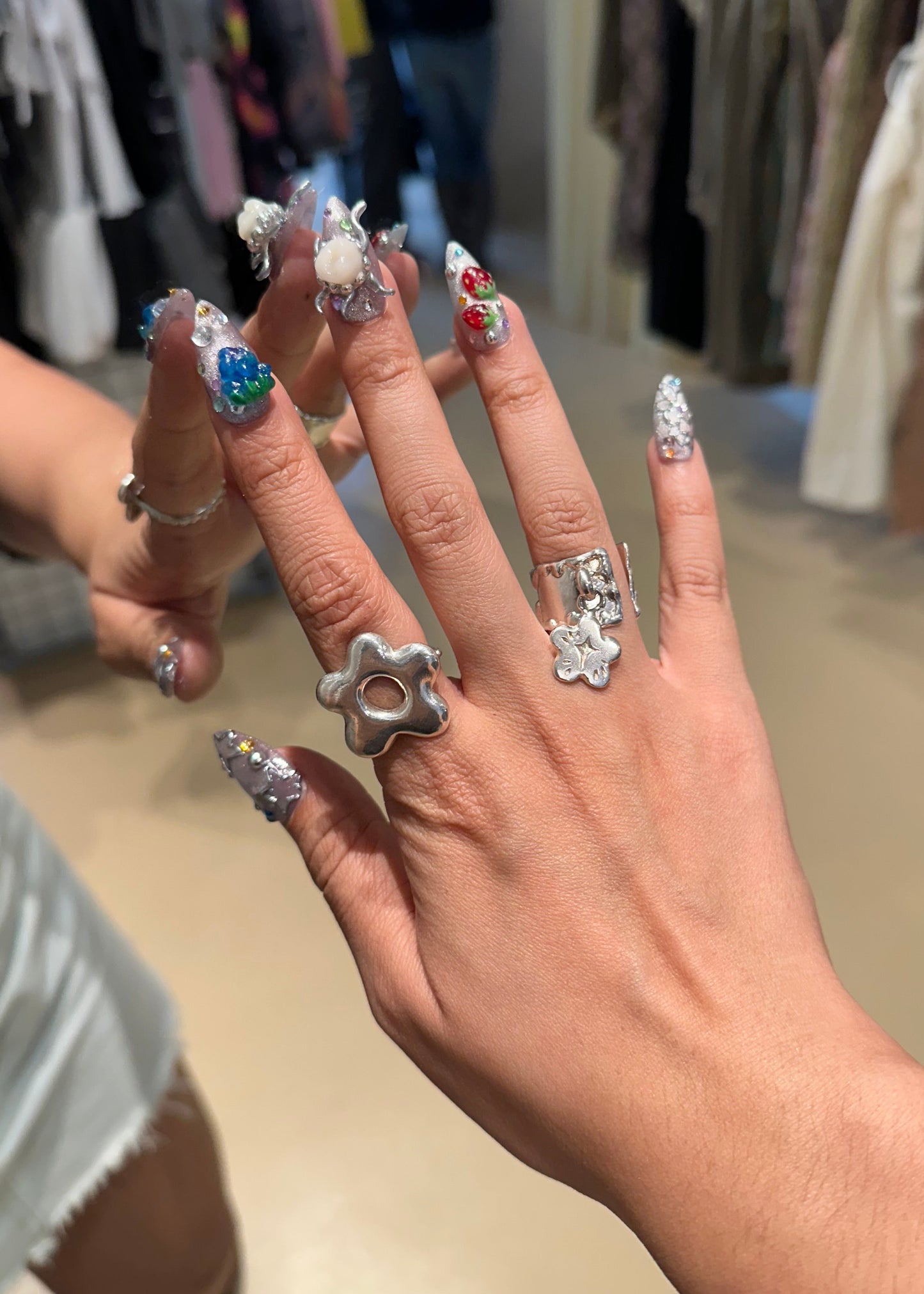 amemori nail styled with handmade silver rings with charm 