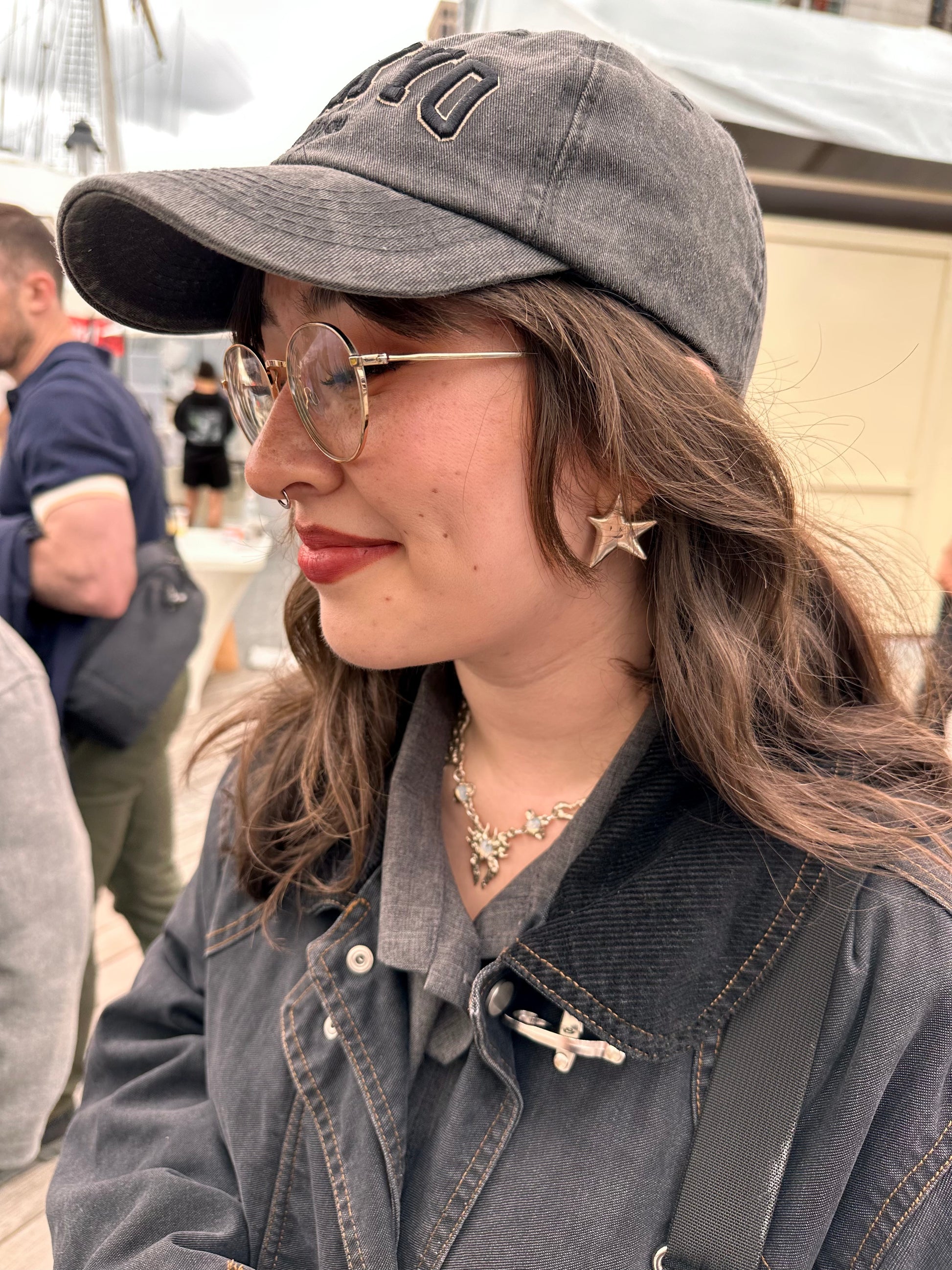 person wearing amemori star earrings with sporty outfit 